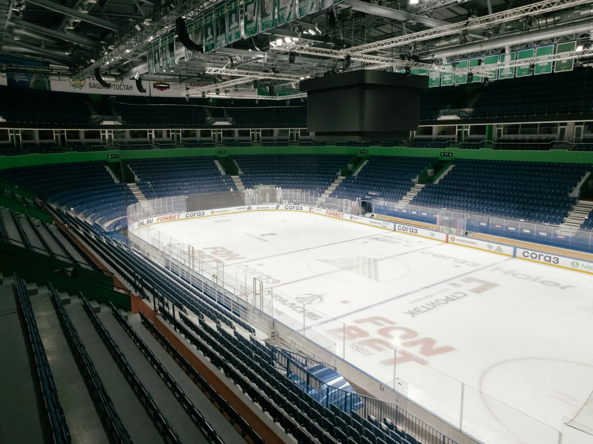 An empty hockey rink with freshly resurfaced ice.